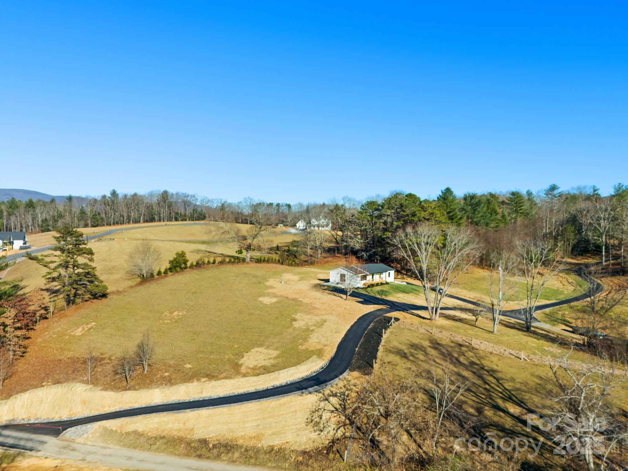 304 Terra Ridge Lane Fletcher, NC 28732 - Photo 2 of 11 a view of a swimming pool with a lake view and mountain view