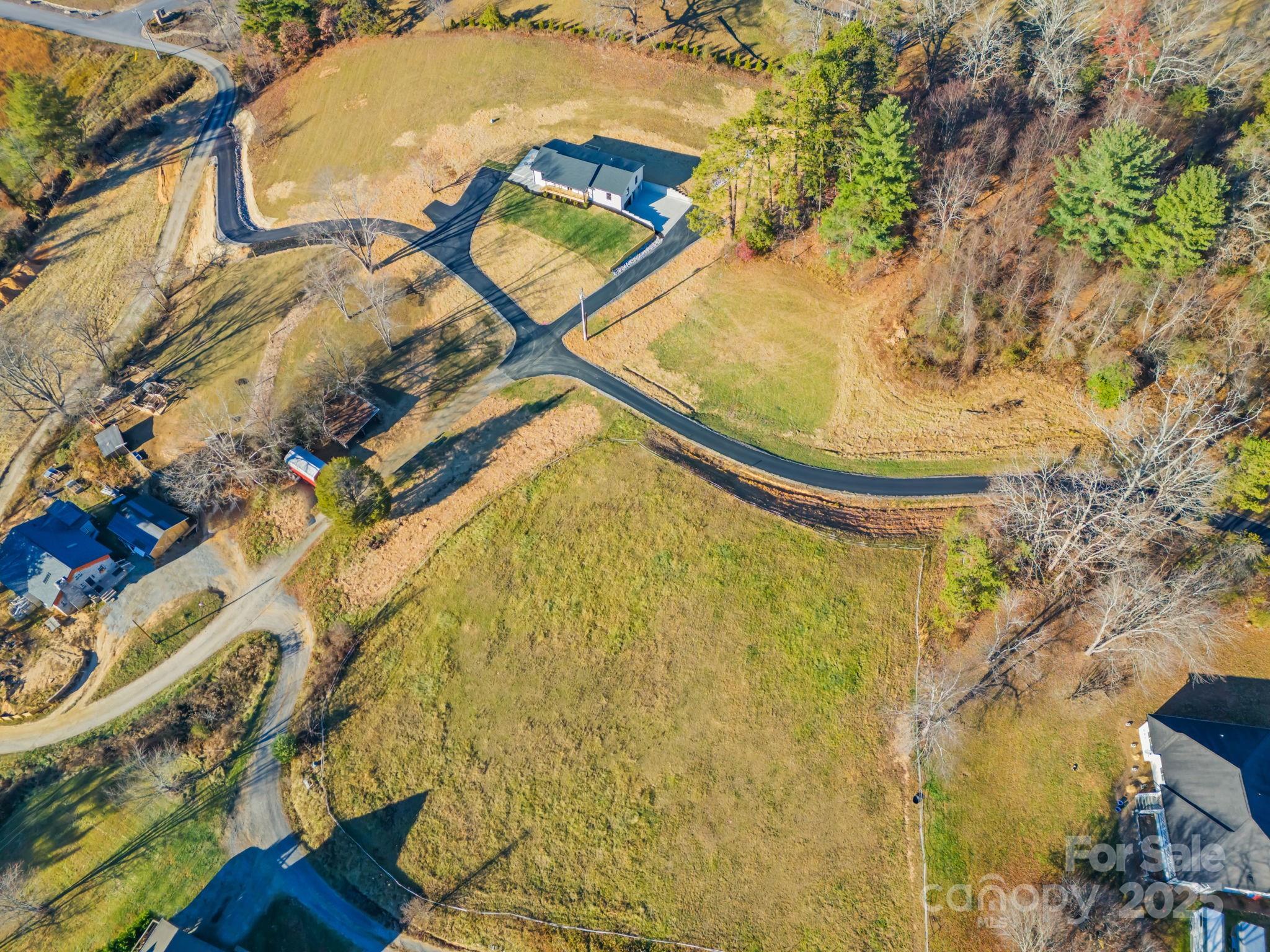 304 Terra Ridge Lane Fletcher, NC 28732 - Photo 9 of 11 a blue umbrella sitting next to a blue house
