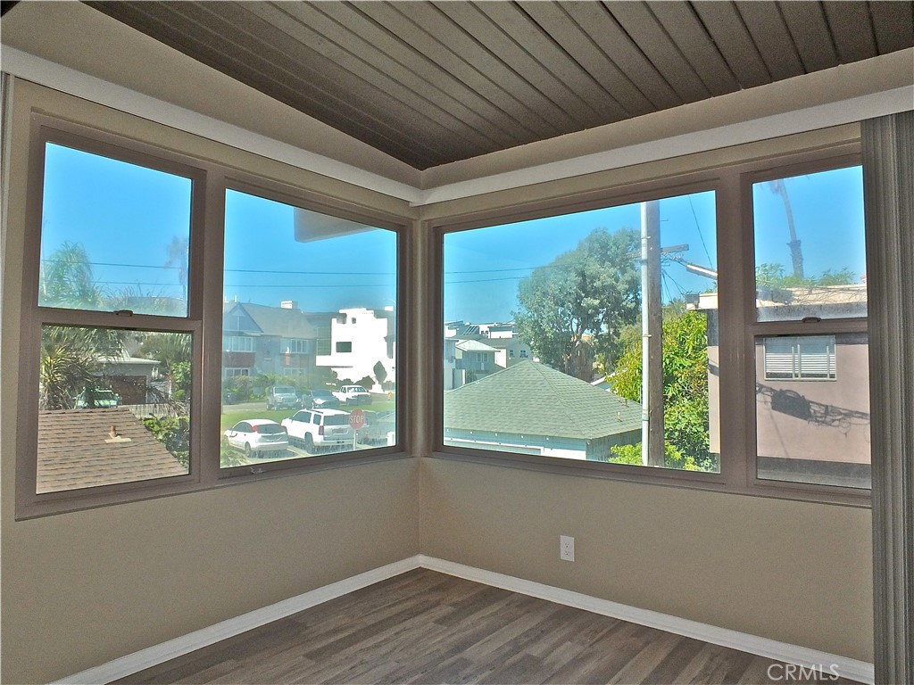17031 7th Street, Unit A Sunset Beach, CA 90742 - Photo 6 of 27 a view of a room that has a large window