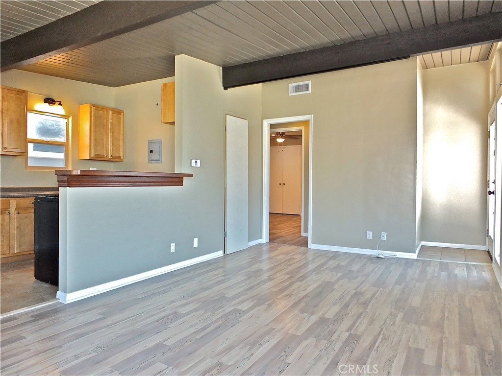 17031 7th Street, Unit A Sunset Beach, CA 90742 - Photo 10 of 27 a view of a livingroom with wooden floor