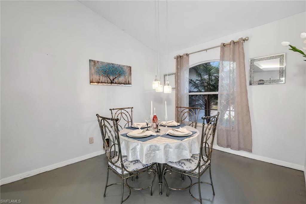220 37th Avenue Northeast Naples, FL 34120 - Photo 16 of 49 a dining room with furniture and window