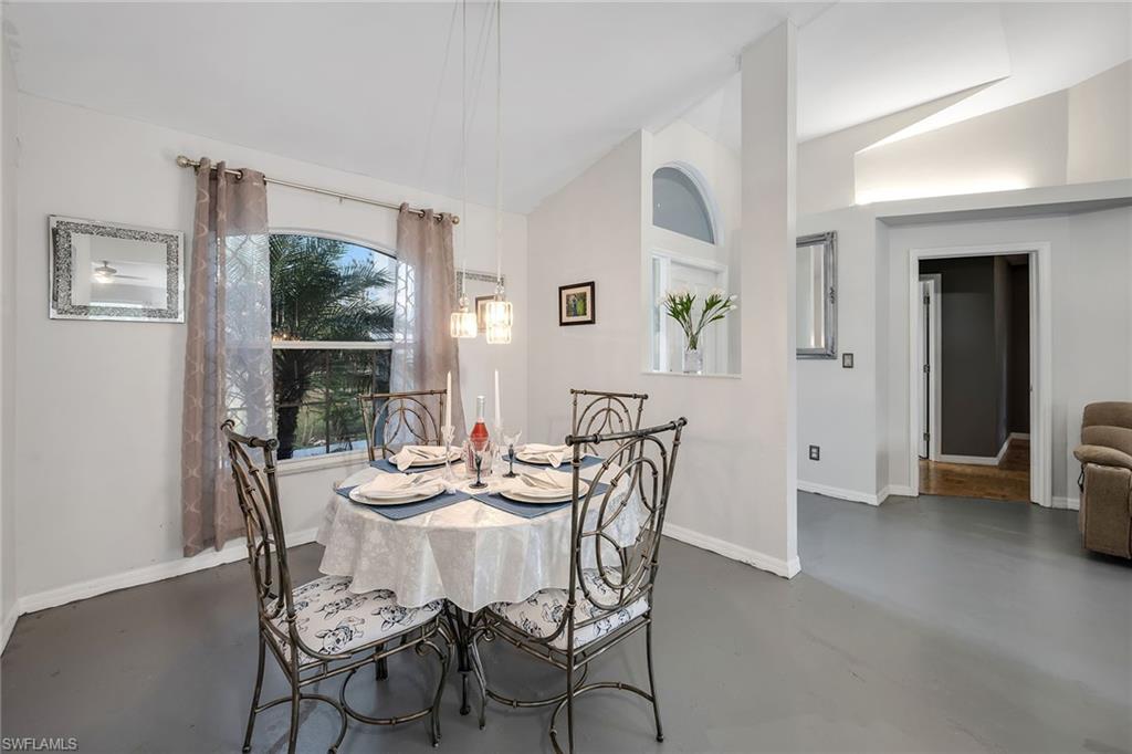 220 37th Avenue Northeast Naples, FL 34120 - Photo 17 of 49 a dining room with furniture and window