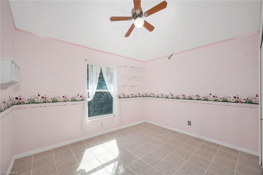 220 37th Avenue Northeast Naples, FL 34120 - Photo 26 of 49 a view of an empty room with a window
