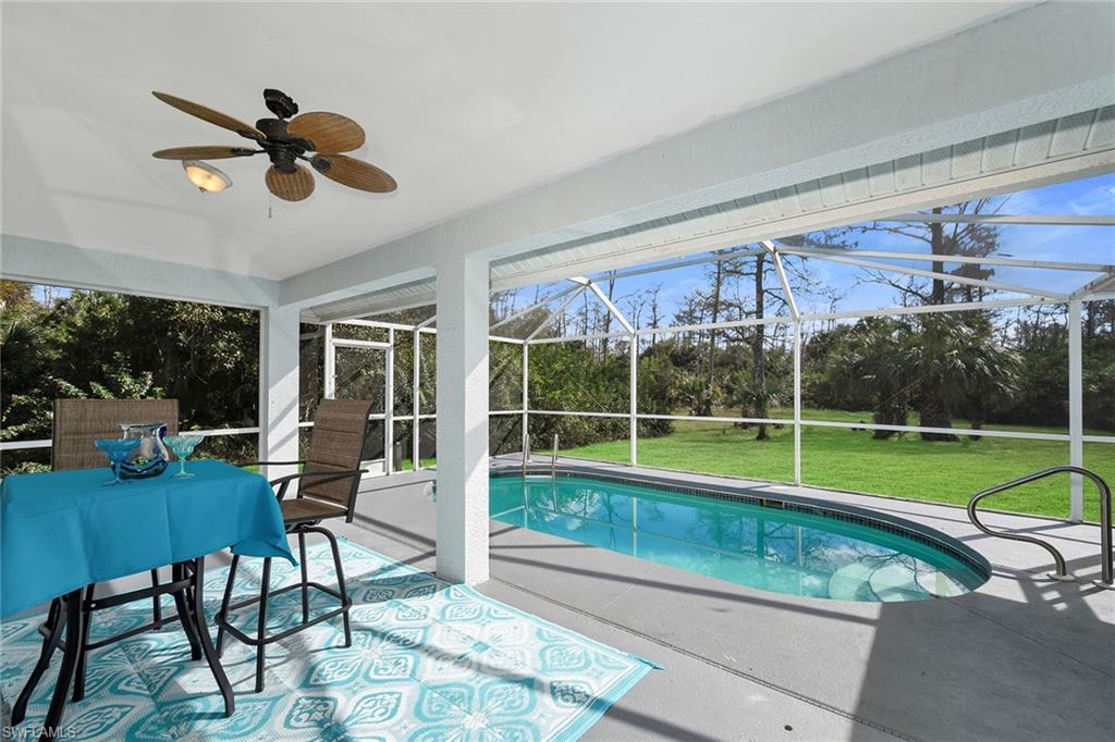 220 37th Avenue Northeast Naples, FL 34120 - Photo 31 of 49 a view of a room with furniture and backyard