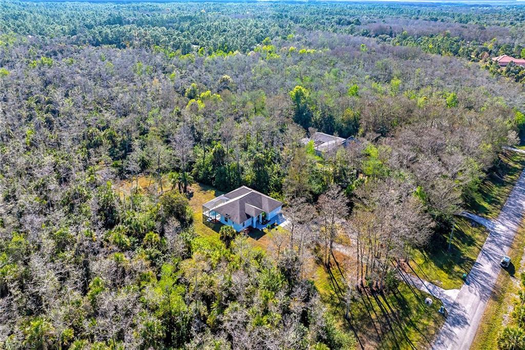 220 37th Avenue Northeast Naples, FL 34120 - Photo 38 of 49 an aerial view of a house with a yard