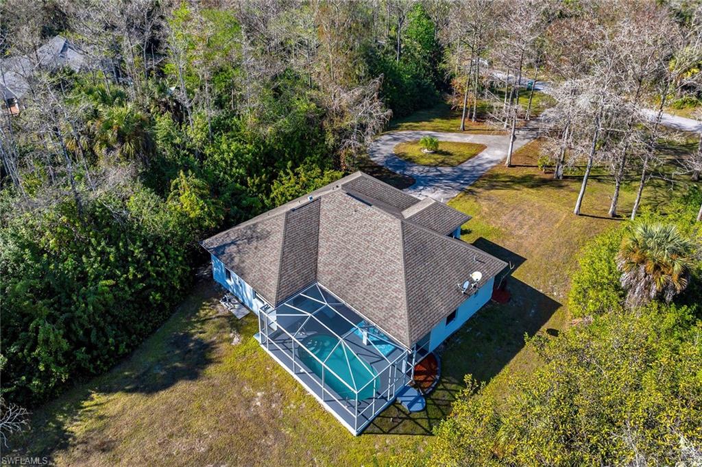 220 37th Avenue Northeast Naples, FL 34120 - Photo 42 of 49 an aerial view of a house with swimming pool and garden view