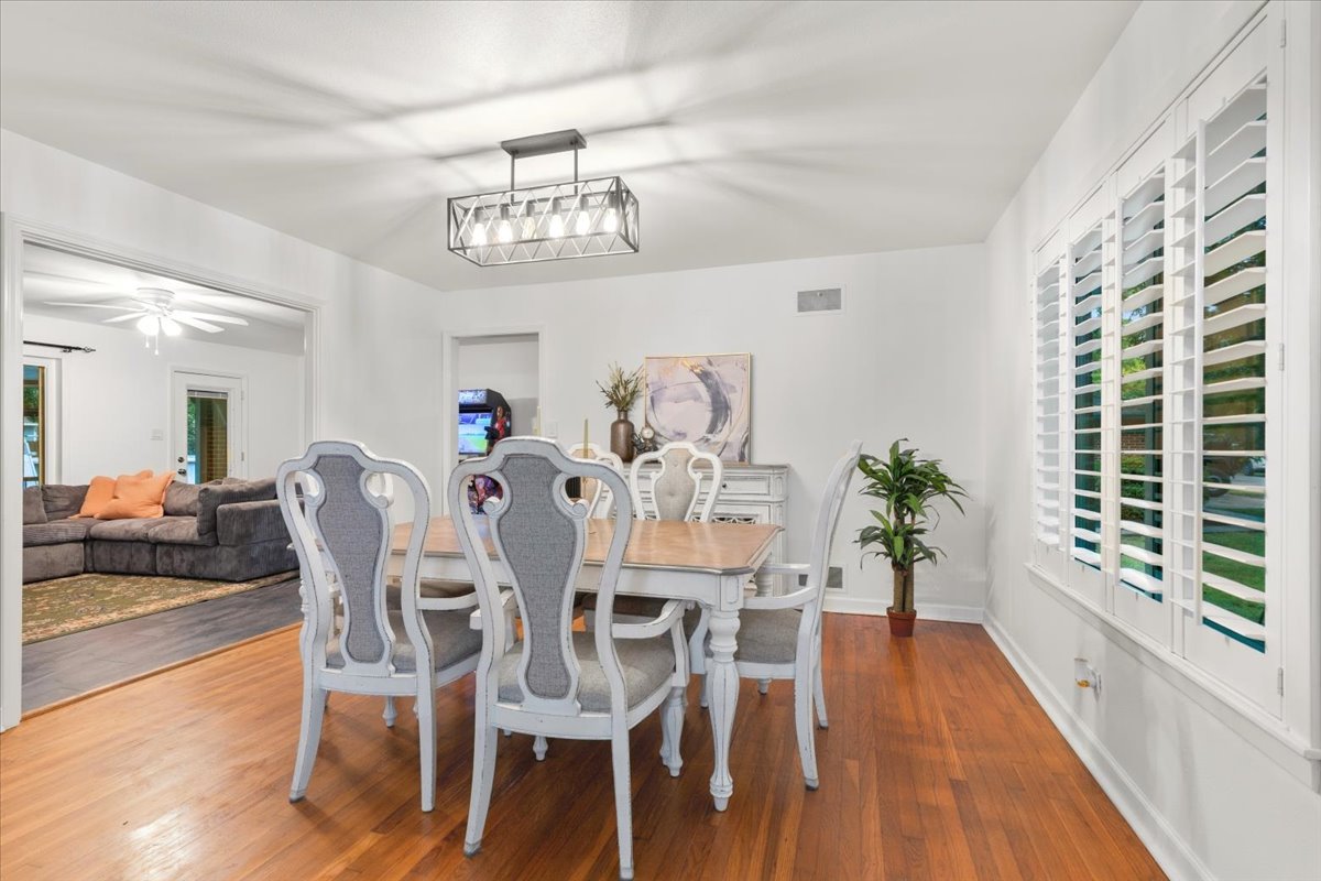 607 Short Street Smithville, TX 78957 - Photo 6 of 31 Dining area featuring wood-finish flooring and white walls