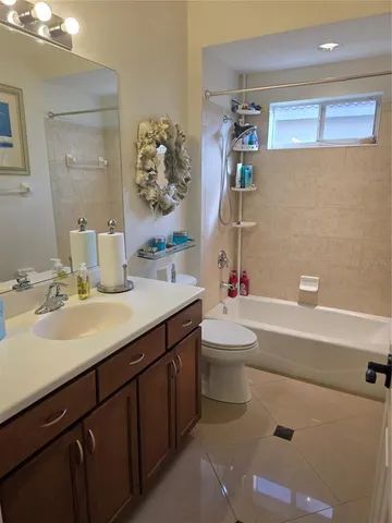 a bathroom with a double vanity sink mirror and double
