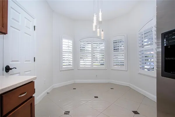 a bathroom with a tub sink shower and mirror