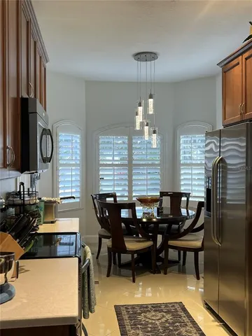 a dining room with furniture and window