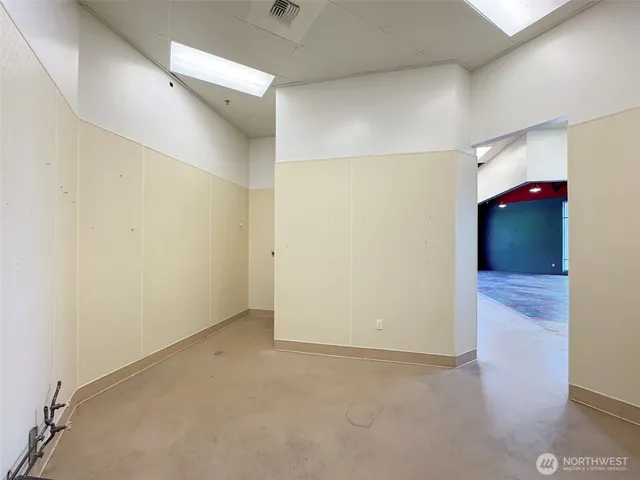 a view of living room with furniture and white walls