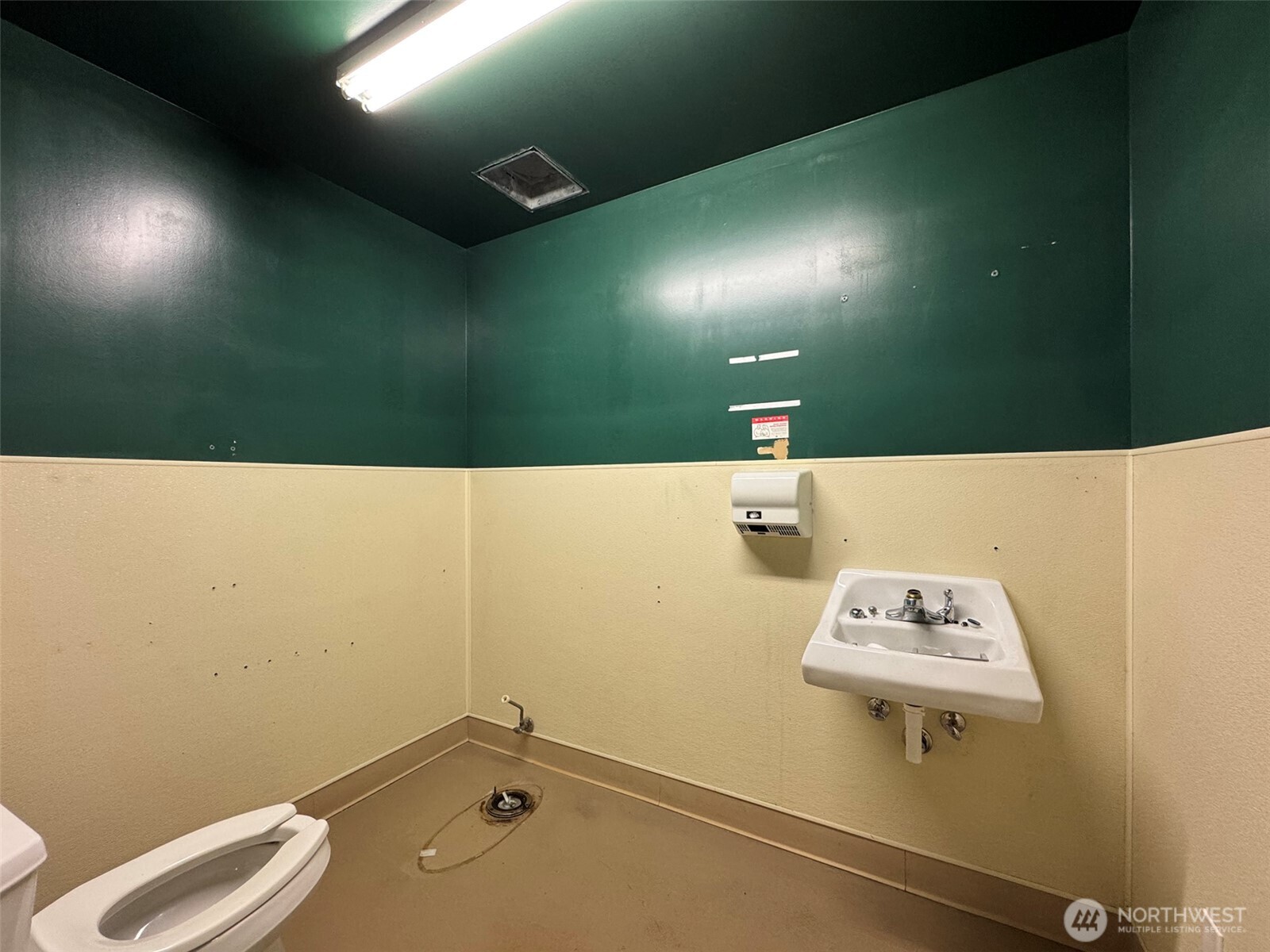 1400 West Washington Street, Unit 101 Sequim, WA 98382 - Photo 20 of 28 a bathroom with a sink and a mirror