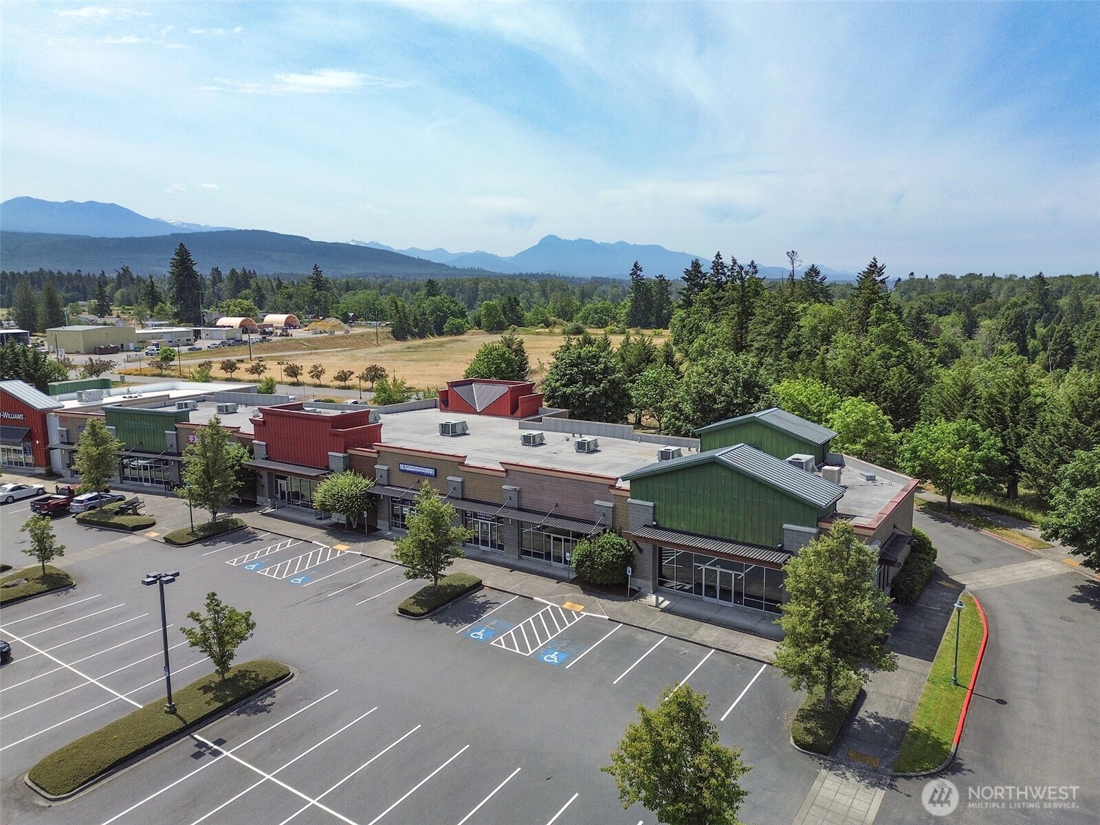 1400 West Washington Street, Unit 101 Sequim, WA 98382 - Photo 26 of 28 an aerial view of a house with a garden