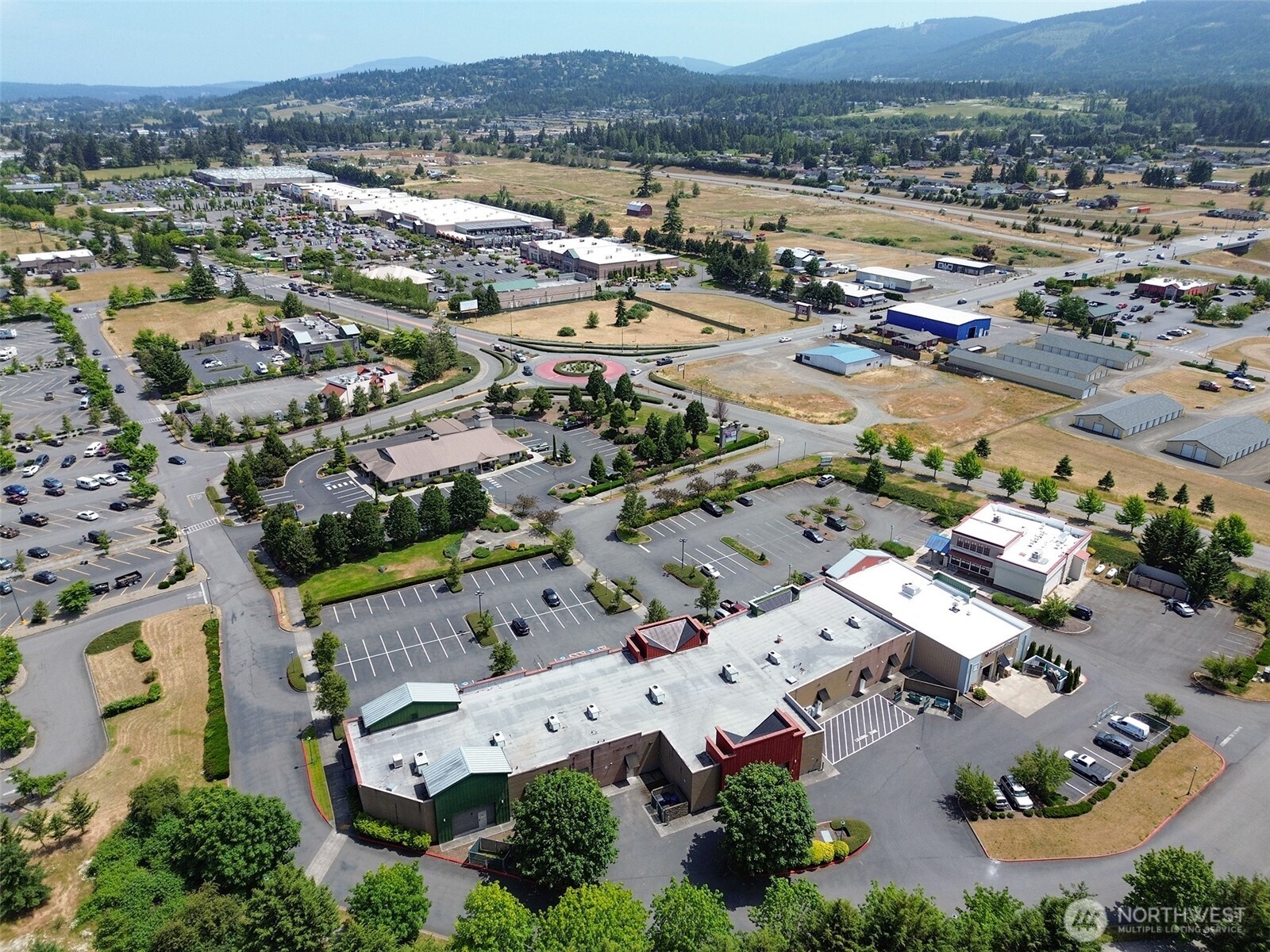 1400 West Washington Street, Unit 101 Sequim, WA 98382 - Photo 28 of 28 an aerial view of a city with lots of residential buildings