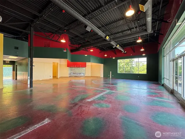 a view of an empty room with a fireplace