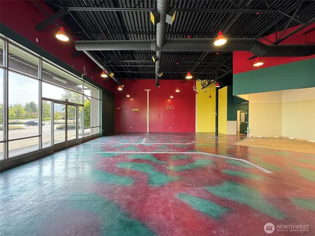 a view of an empty room with a fireplace
