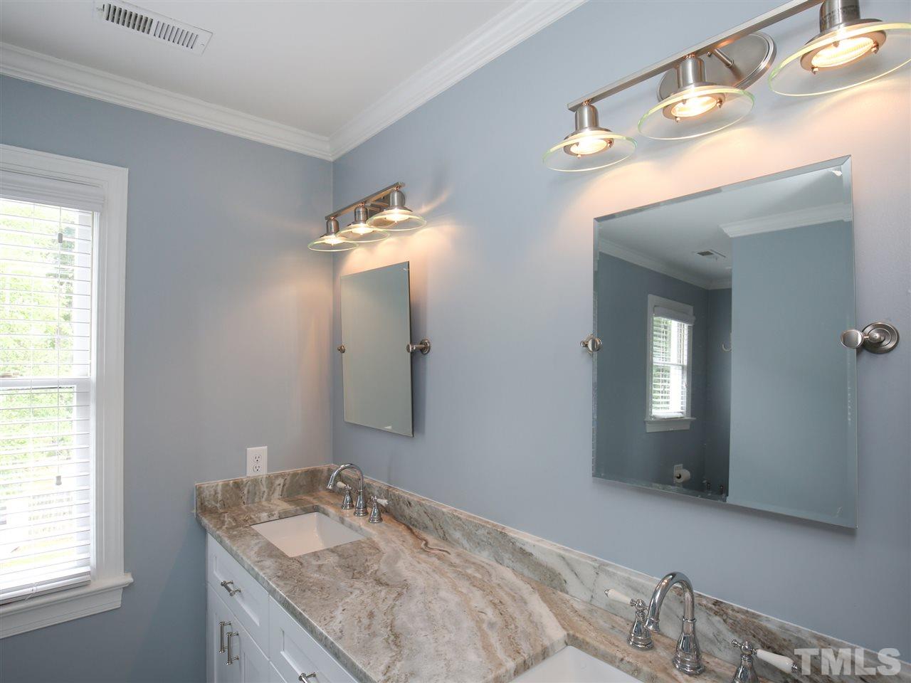 2116 Osprey Circle Raleigh, NC 27615 - Photo 17 of 25 Double vanities with drawer bank and granite countertop