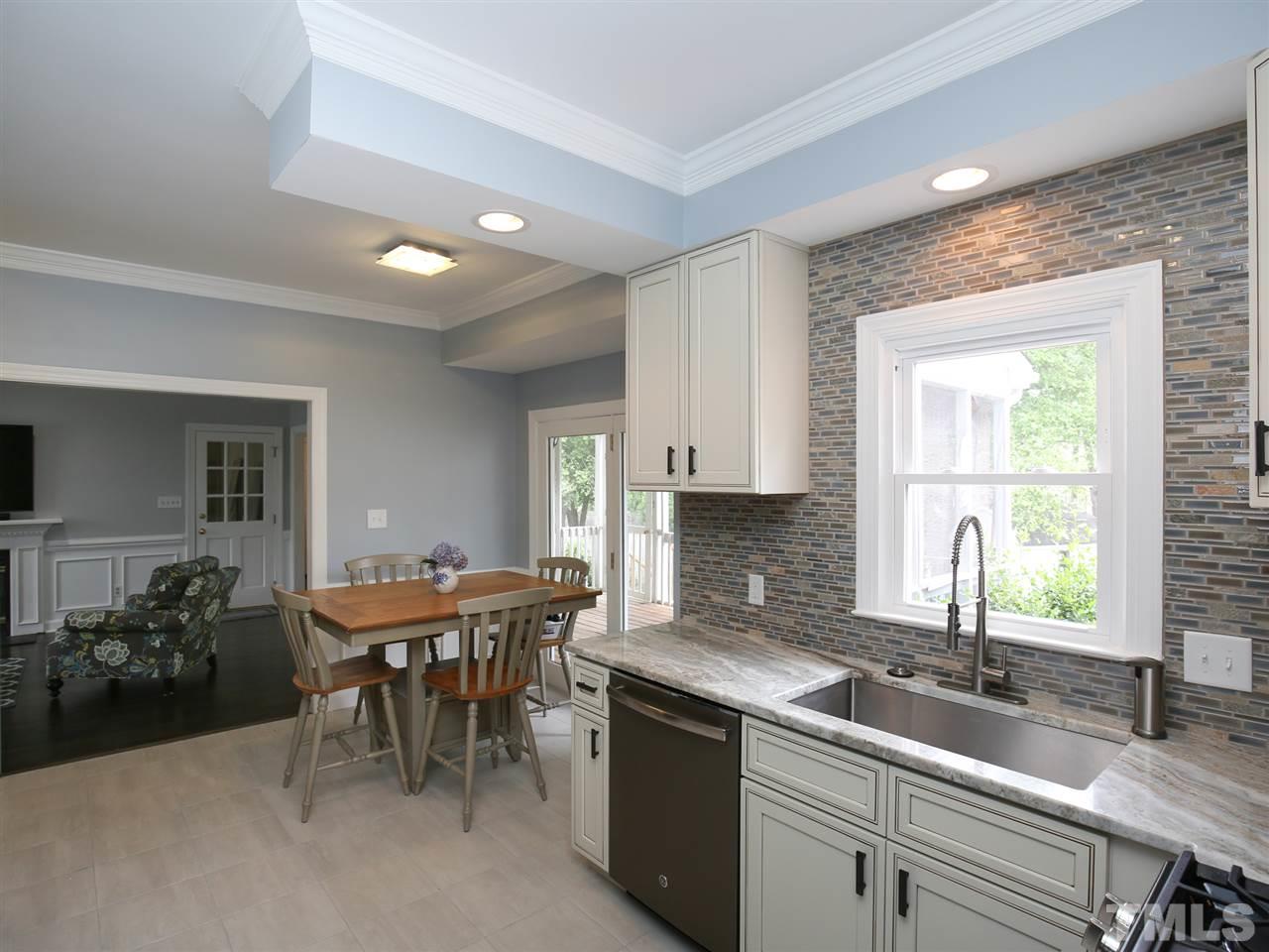 2116 Osprey Circle Raleigh, NC 27615 - Photo 7 of 25 Completely renovated kitchen w/ new cabinets, appliances, countertop, & backsplash