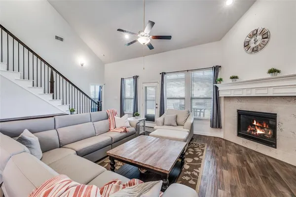 a living room with furniture and a fireplace