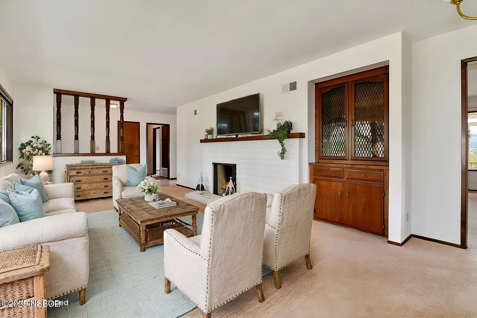 1740 Tularosa Road Lompoc, CA 93436 - Photo 13 of 55 a living room with furniture a flat screen tv and a fireplace