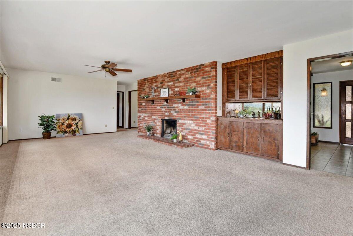 1740 Tularosa Road Lompoc, CA 93436 - Photo 18 of 55 an empty room with furniture and a fireplace