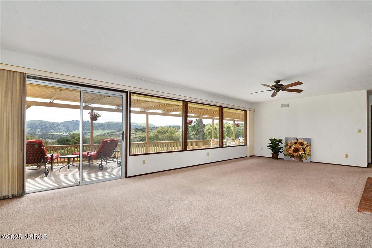 1740 Tularosa Road Lompoc, CA 93436 - Photo 19 of 55 an empty room with furniture and a floor to ceiling window