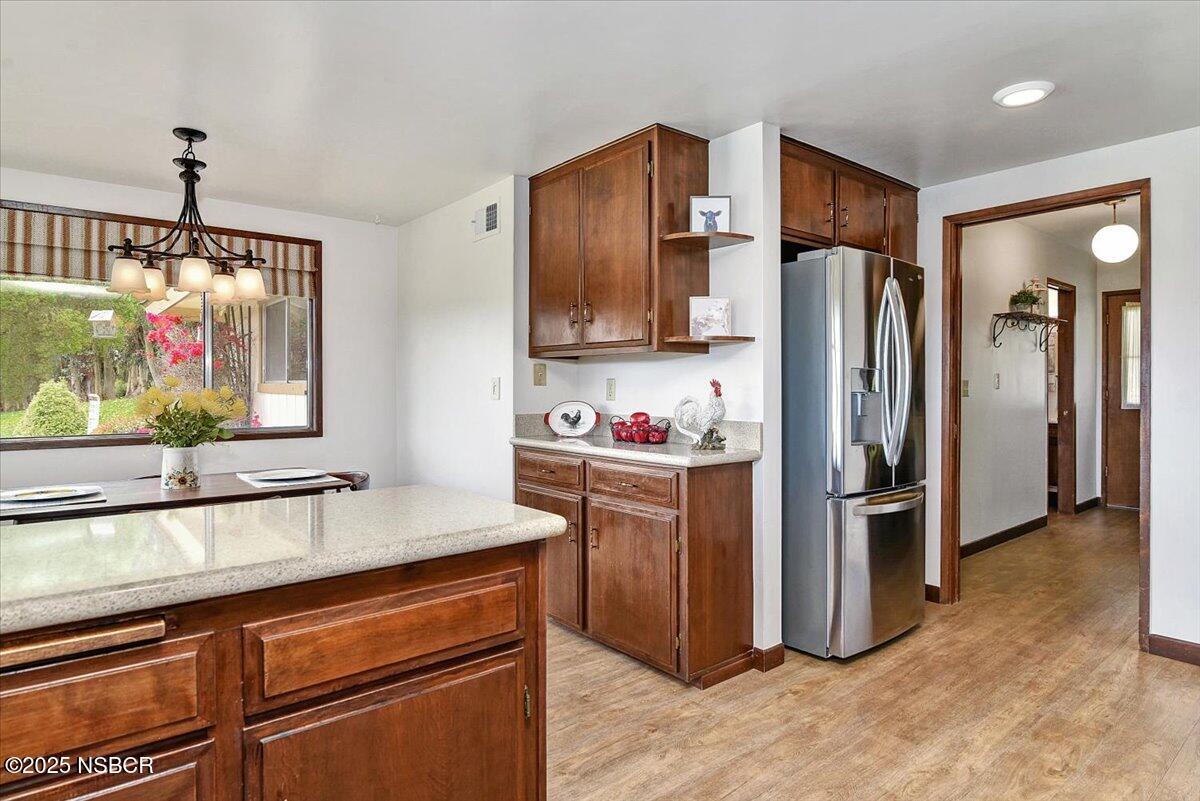 1740 Tularosa Road Lompoc, CA 93436 - Photo 24 of 55 a kitchen with stainless steel appliances granite countertop a refrigerator and a sink