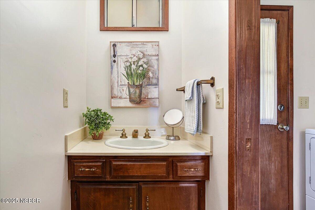 1740 Tularosa Road Lompoc, CA 93436 - Photo 29 of 55 a bathroom with a sink and a mirror