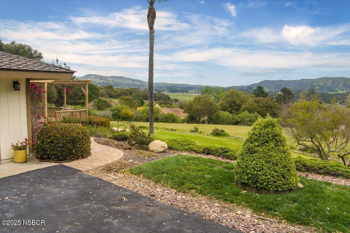 1740 Tularosa Road Lompoc, CA 93436 - Photo 3 of 55 a view of a garden with a slide