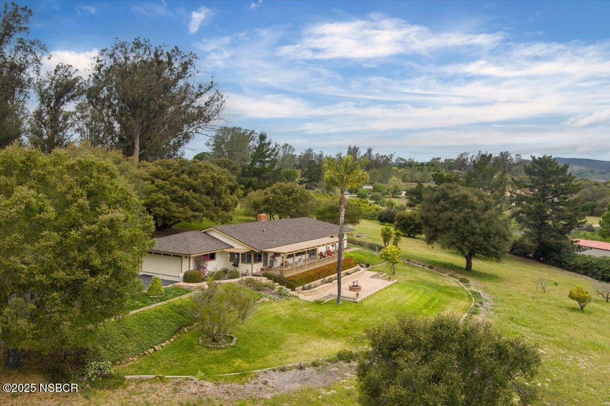 1740 Tularosa Road Lompoc, CA 93436 - Photo 41 of 55 a view of a big yard with potted plants and large tree