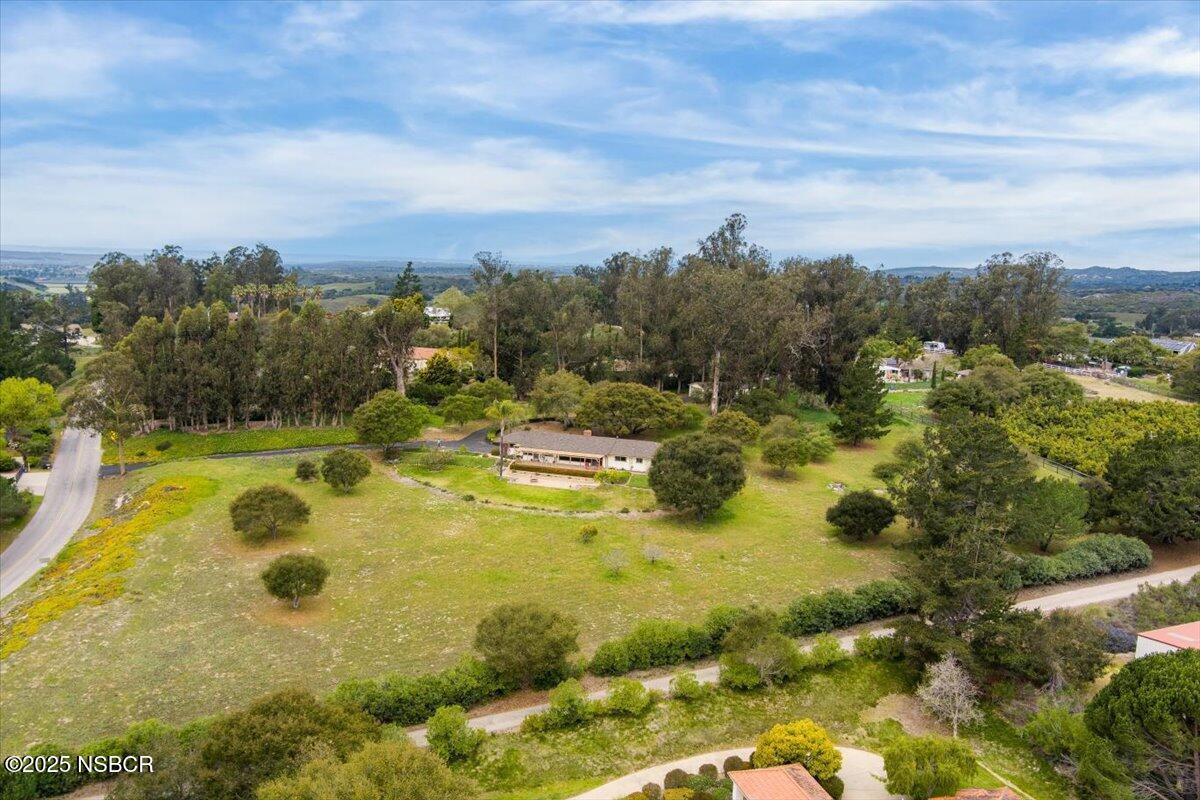 1740 Tularosa Road Lompoc, CA 93436 - Photo 7 of 55 a view of a swimming pool with an outdoor seating