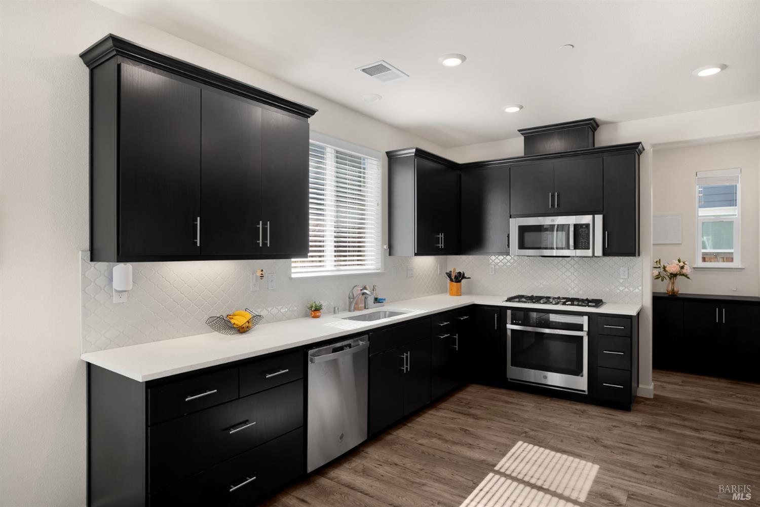 7465 Walker Way Rohnert Park, CA 94928 - Photo 11 of 43 a kitchen with a sink and stainless steel appliances