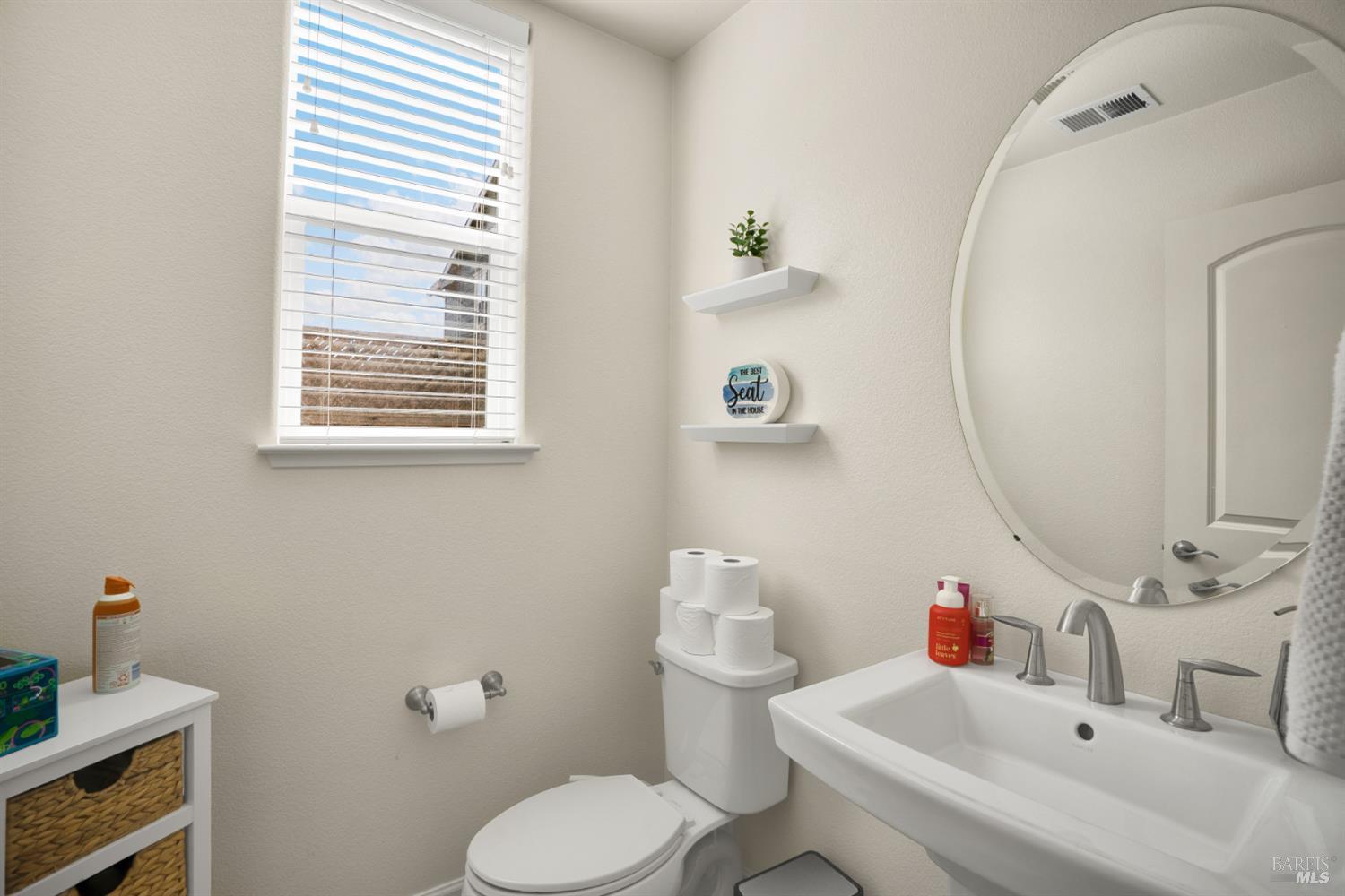 7465 Walker Way Rohnert Park, CA 94928 - Photo 17 of 43 a bathroom with a sink mirror and toilet