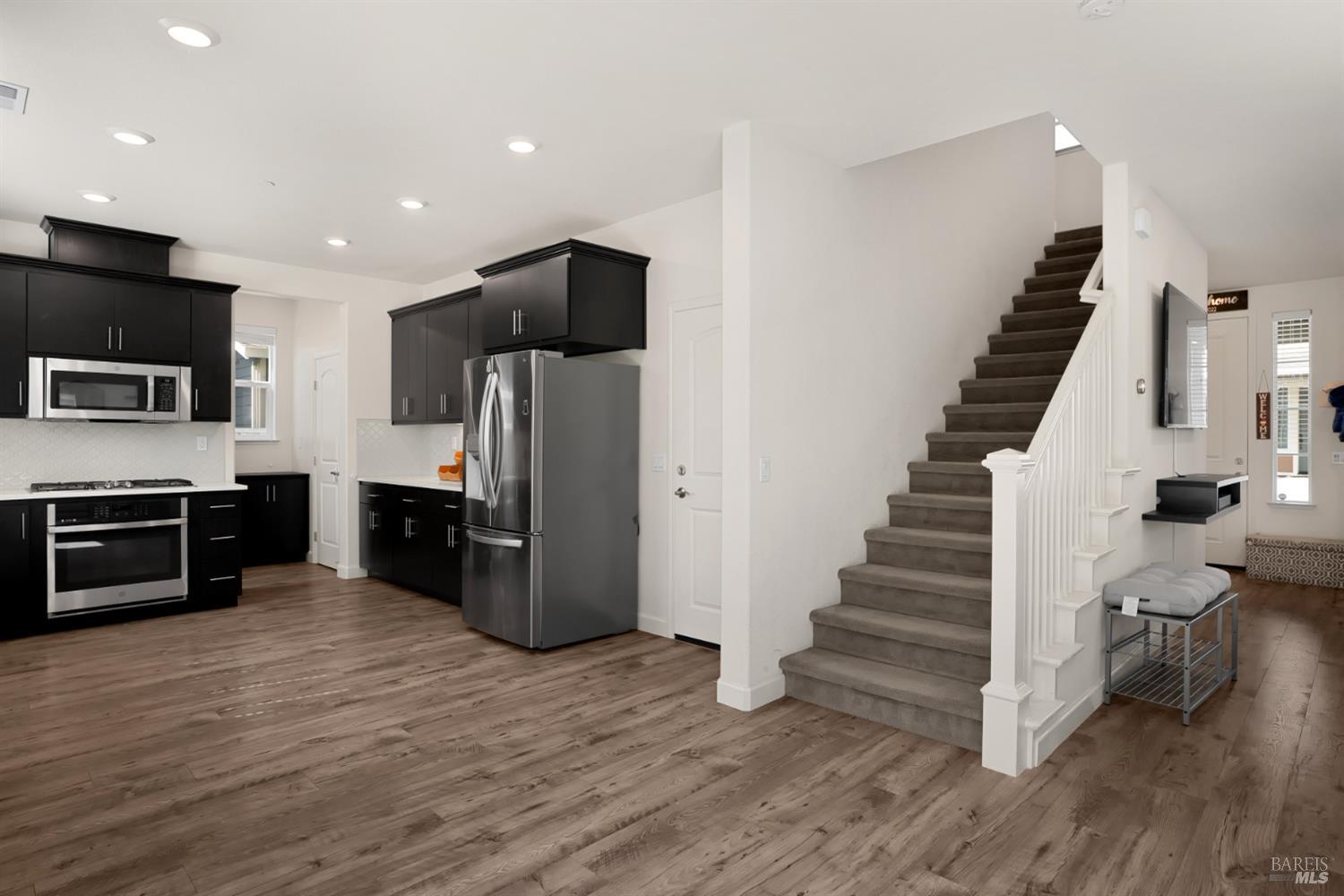 7465 Walker Way Rohnert Park, CA 94928 - Photo 18 of 43 a kitchen with stainless steel appliances a refrigerator and a stove top oven