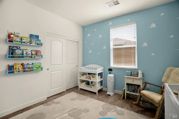 a view of room with baby crib