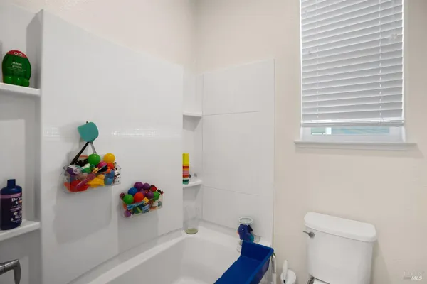 a bathroom with a sink a bathtub and a toilet