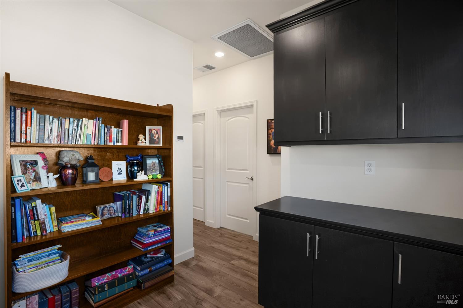 7465 Walker Way Rohnert Park, CA 94928 - Photo 25 of 43 a kitchen with stainless steel appliances a cabinets and a book shelf