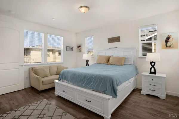 a bedroom with a bed and a couch