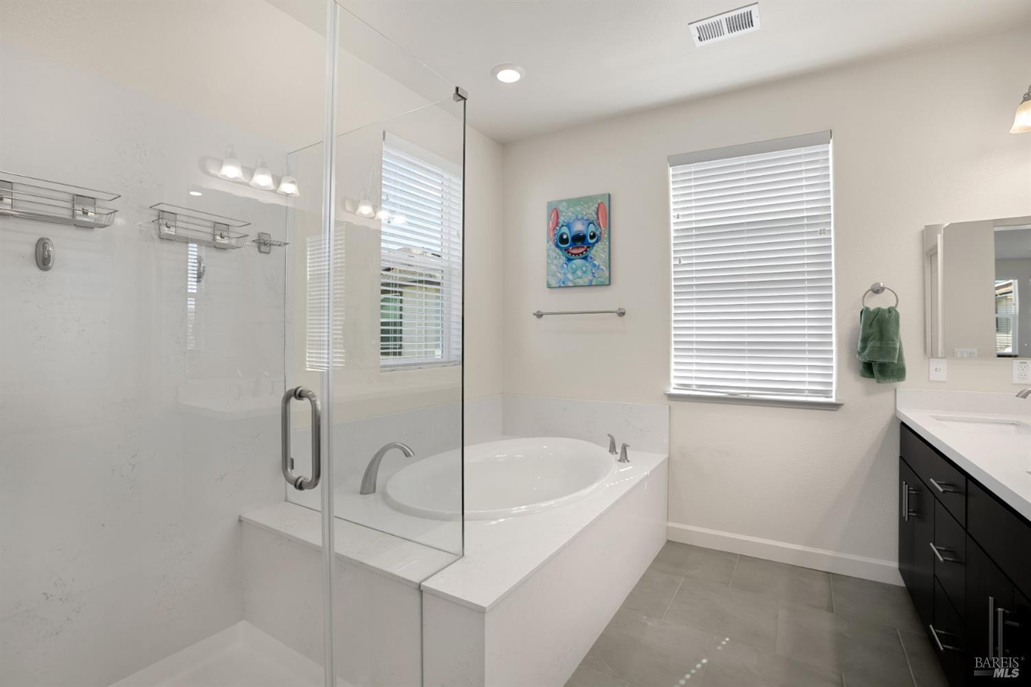 7465 Walker Way Rohnert Park, CA 94928 - Photo 29 of 43 a white bath tub sitting in a bathroom next to a window