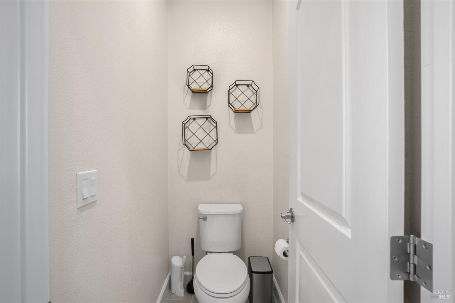7465 Walker Way Rohnert Park, CA 94928 - Photo 33 of 43 a white toilet sitting next to a white walls