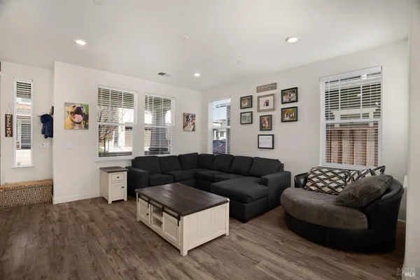a living room with furniture and windows