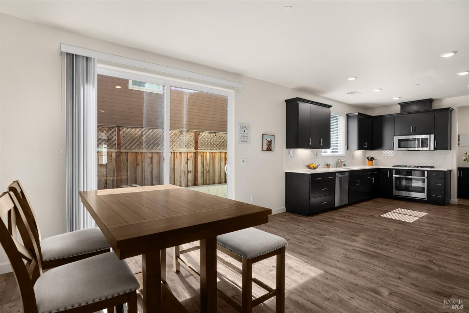 7465 Walker Way Rohnert Park, CA 94928 - Photo 10 of 43 a view of a dining room with furniture and wooden floor