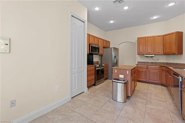 a kitchen with a cabinets counter top space and windows