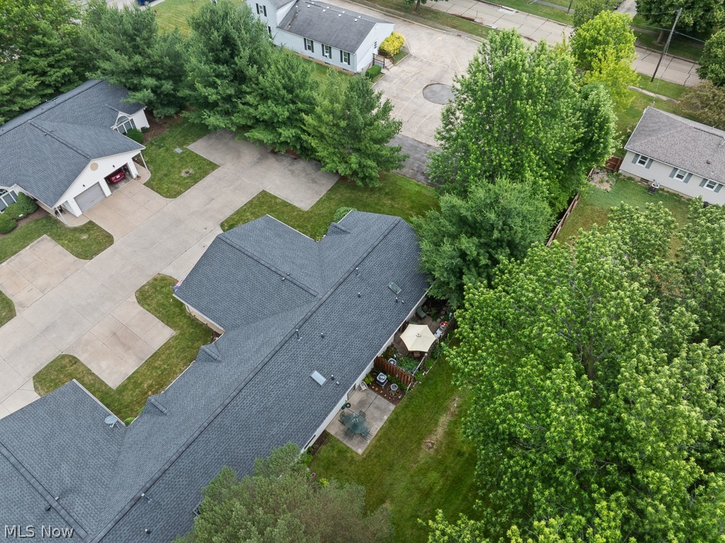 808 Ryan Road, Unit 14 Medina, OH 44256 - Photo 39 of 40 Property featuring a dark gray shingle roof and a private concrete patio area