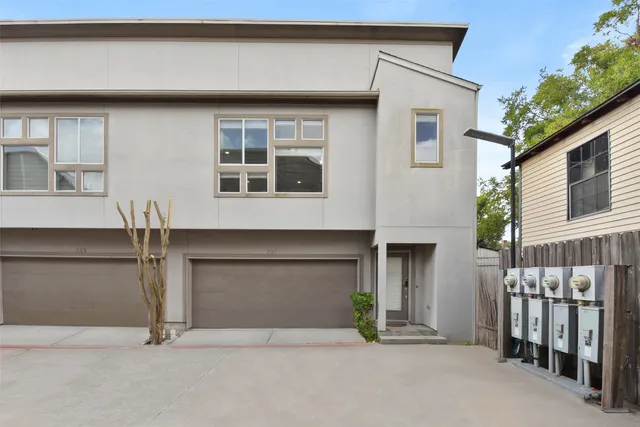 a front view of a house with garage