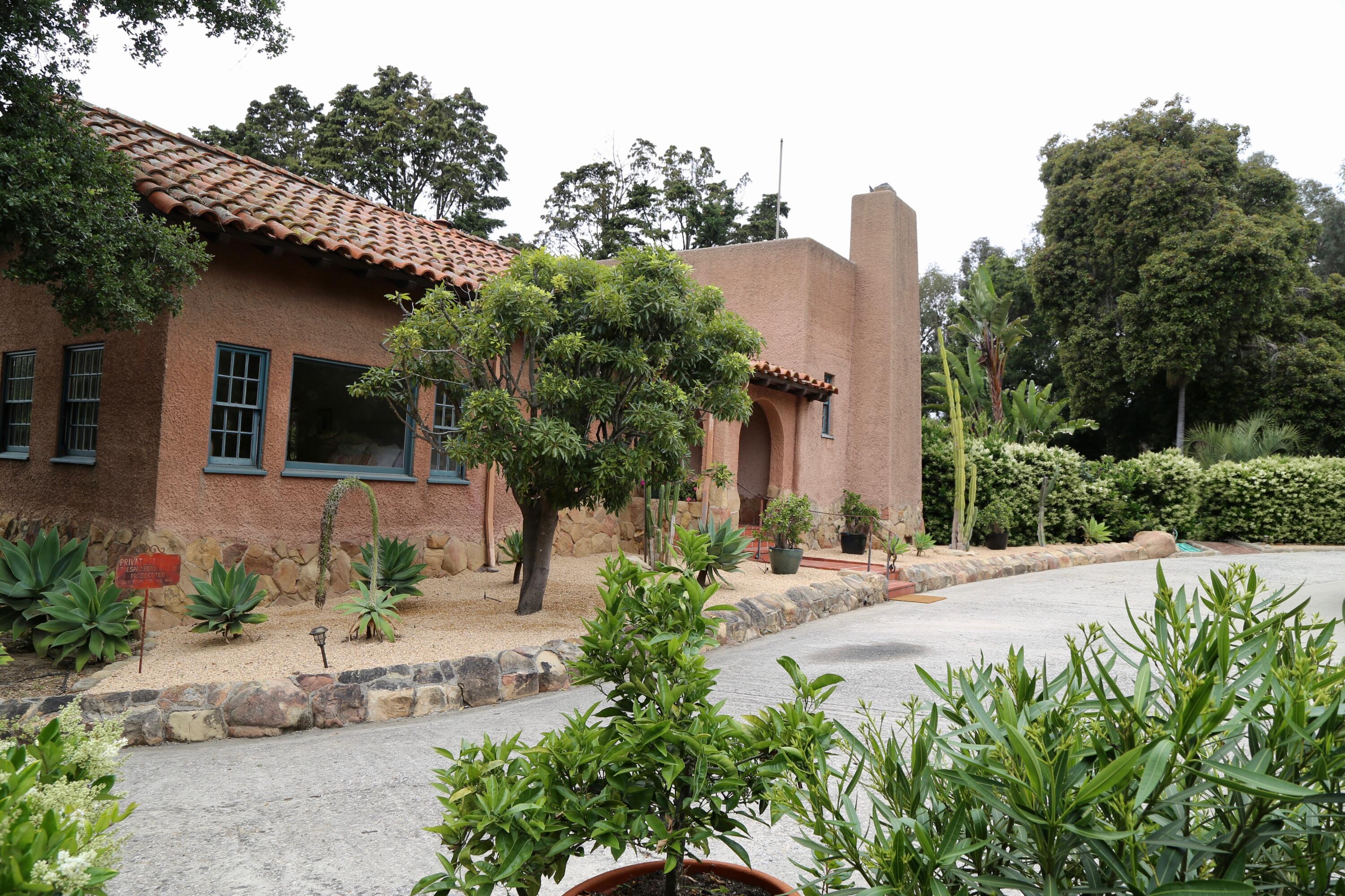 2065 Mission Ridge Road Santa Barbara, CA 93103 - Photo 4 of 49 a front view of a house with a yard