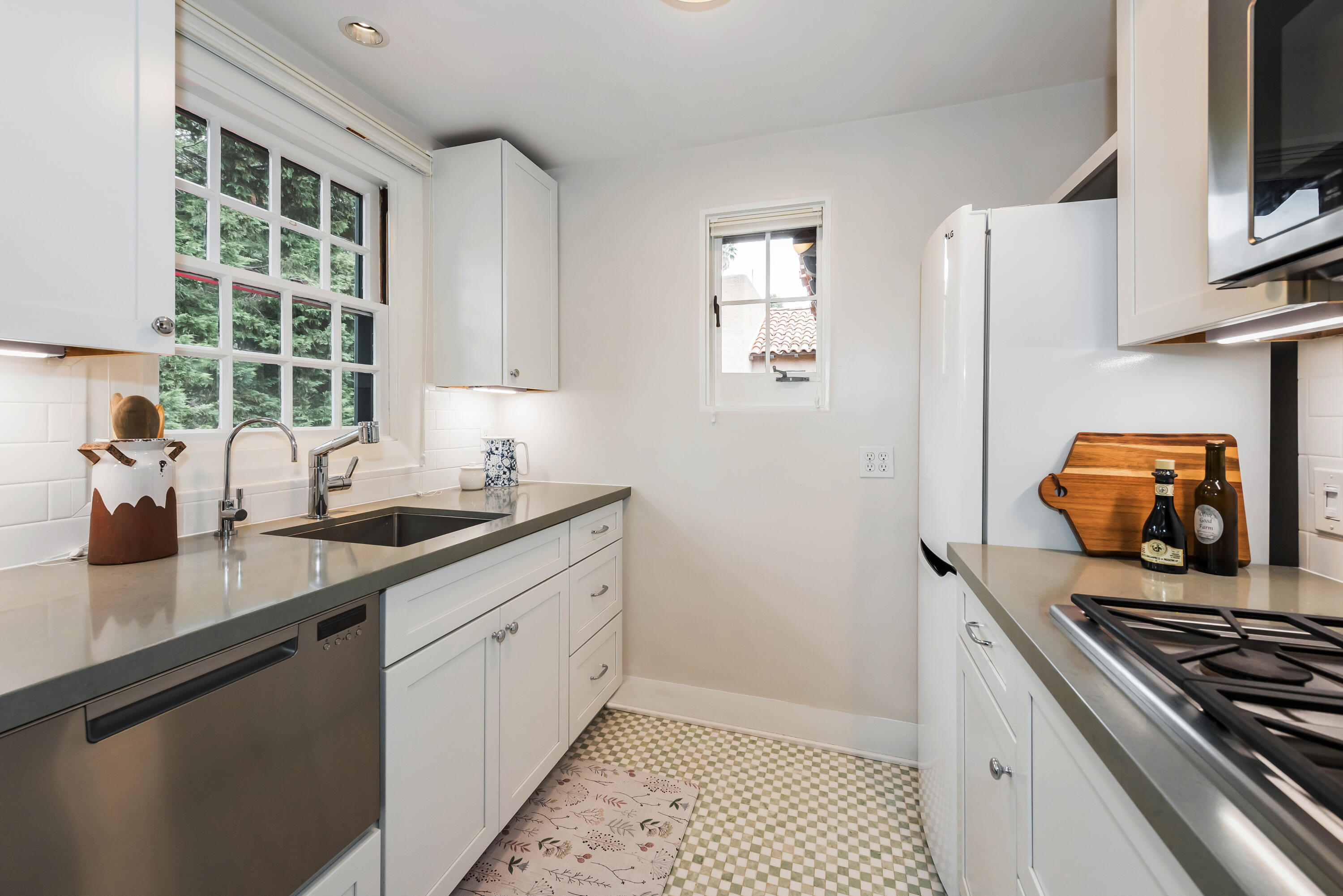 2065 Mission Ridge Road Santa Barbara, CA 93103 - Photo 49 of 49 a kitchen with stainless steel appliances granite countertop a sink stove and cabinets
