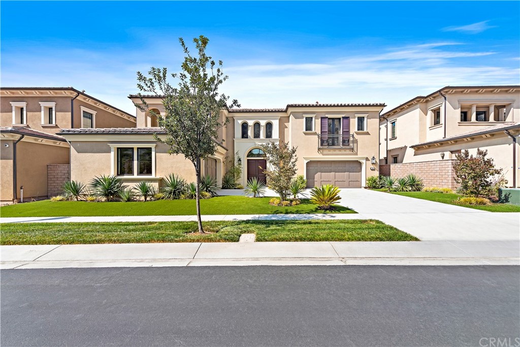 186 Leafy Pass Irvine, CA 92602 - Photo 2 of 59 a front view of house with yard and green space