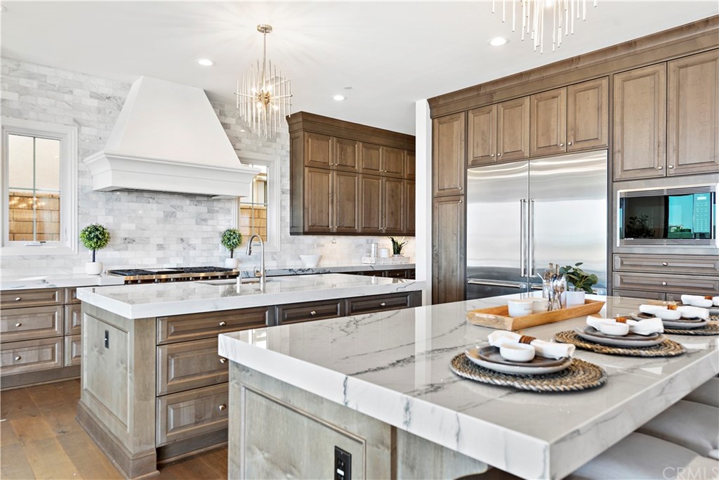 186 Leafy Pass Irvine, CA 92602 - Photo 20 of 59 a kitchen with a stove cabinets and counter space