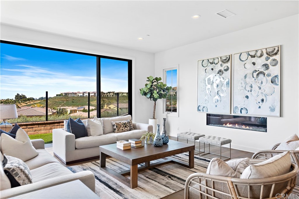 186 Leafy Pass Irvine, CA 92602 - Photo 24 of 59 a living room with furniture and a large window